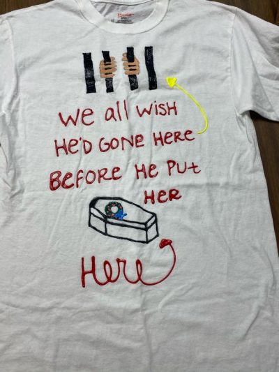 "We all wish he'd gone here *referencing jail* before he put her here *referencing a coffin*. White represents people who have died due to violence.