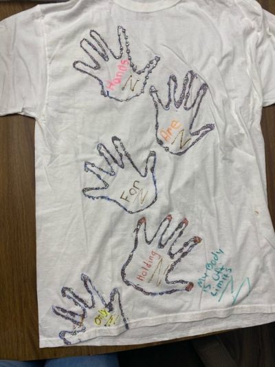 "Hands are for holding only." "My body is off limits." White represents people who have died due to violence.