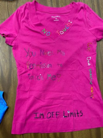 "No touch." "Off limits." "You need permission to touch me!" "We don't deserve this!" Pink represents survivors of rape and sexual assault.