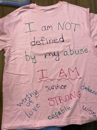 "I am NOT defined by my abuse." "I am: survivor, worthy of love, strong, capable, wise, defend." Pink represents survivors of rape and sexual assault.