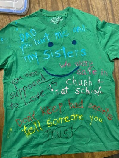 "Dad you hurt me and my sisters. You were supposed to love us." "We were safe at church and at school." "Don't keep bad secrets, tell someone you trust." Green represents survivors of incest or child sexual violence.