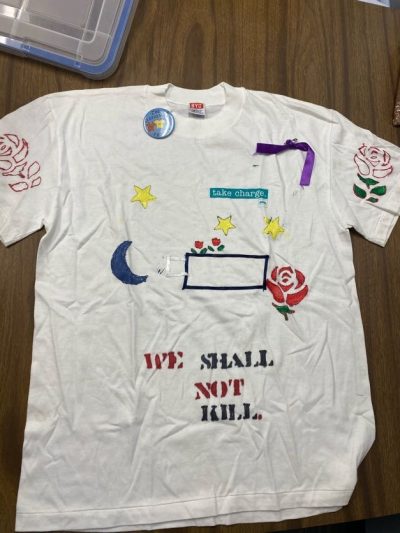 "We shall not kill." White represents people who have died due to violence.