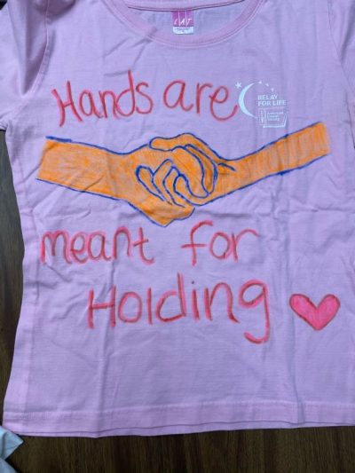 "Hands are meant for holding." Lavender represents those who were attacked because of their gender identity or sexual orientation.