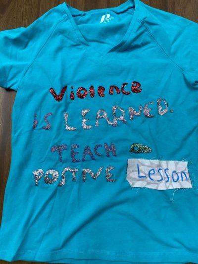 “Violence is learned. Teach positive lessons." Blue represents people who are survivors of incest or child sexual abuse.